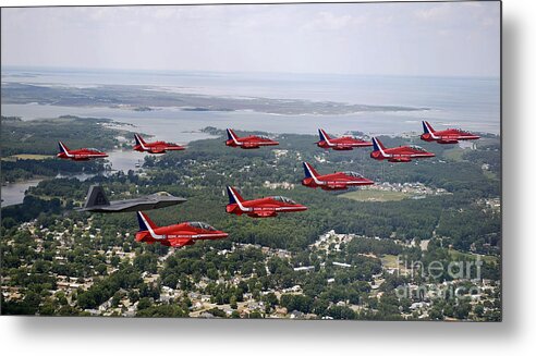 Performing Metal Print featuring the photograph A F-22 Raptor Flies In Formation by Stocktrek Images