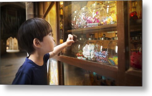 4-5 Years Metal Print featuring the photograph East asian young boy looking at colourful candy jars. by Twomeows