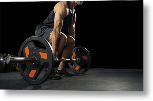 Toughness Metal Print featuring the photograph Handsome weightlifter preparing for training. Training with barbell, Athletic shirtless young sports man. Fitness model with barbell in gym by CrispyPork