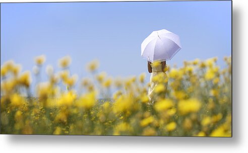 Mature Adult Metal Print featuring the photograph Woman holding umbrella in field of yellow flowers by Peter Cade