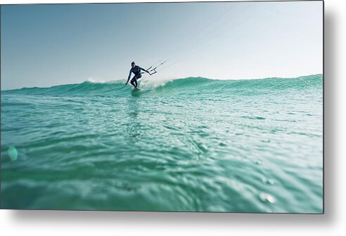 Mid Adult Women Metal Print featuring the photograph A Woman Kitesurfing by Ben Welsh / Design Pics