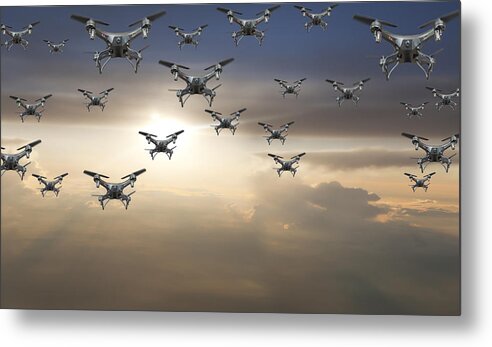 Threats Metal Print featuring the photograph Flock of drones in the sky at sunset by Buena Vista Images