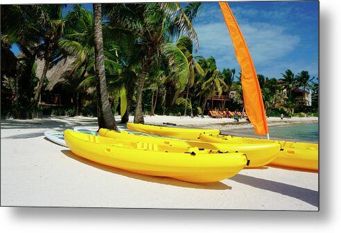 Belize Metal Print featuring the photograph Kayaks on the beach of Ambergris Caye Belize by Waterdancer