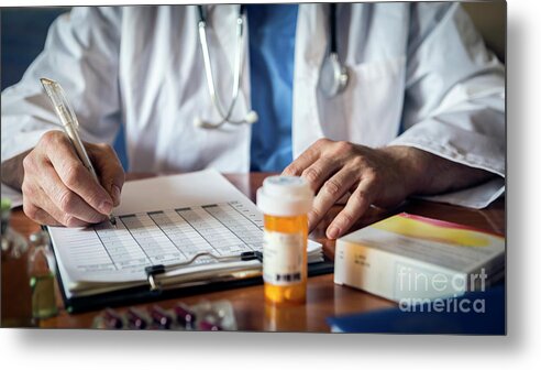 Care Metal Print featuring the photograph Doctor Writing Notes On Medication by Digicomphoto/science Photo Library