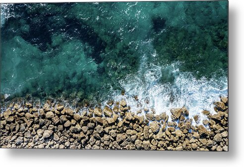 Seascape Metal Print featuring the photograph Aerial view from flying drone of crystal blue ocean water and sea wall. by Michalakis Ppalis