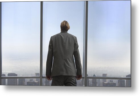 Corporate Business Metal Print featuring the photograph Businessman In His Office Overlooking A City by Buena Vista Images
