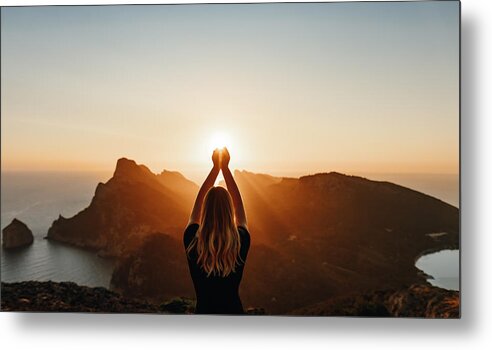 Tranquility Metal Print featuring the photograph Young woman in spiritual pose holding the light by DianaHirsch