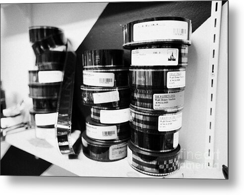 Old Metal Print featuring the photograph 35mm cinema films on shelf in old cinema projection room Biggar Saskatchewan Canada #1 by Joe Fox