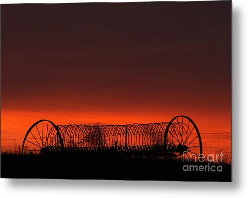Sunset Metal Print featuring the photograph Hayrake at Sunset by Tiffany Whisler