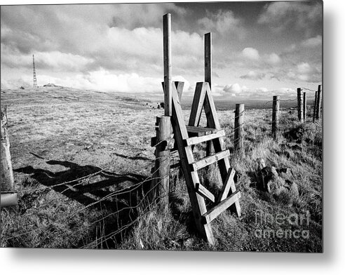Northern Ireland Metal Print featuring the photograph wooden stile over fence on the summit of Slieve Gallion County Derry Northern Ireland by Joe Fox