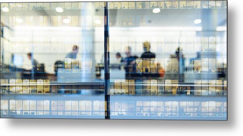 Working Metal Print featuring the photograph Workers working late. Tall building reflected by Olaser
