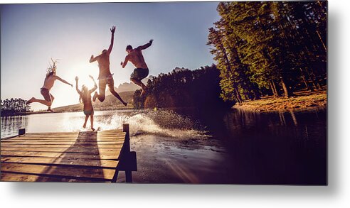 Child Metal Print featuring the photograph Jumping Into The Water From A Jetty by Wundervisuals