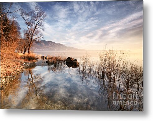 Dawn Metal Print featuring the photograph Winter sunrise over lake in North Italy by Matteo Colombo