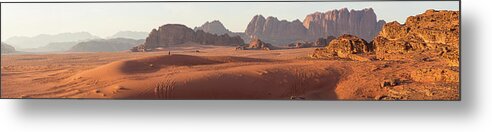 Scenics Metal Print featuring the photograph Bedouin Man Walking Across Wadi Rum by Peter Adams