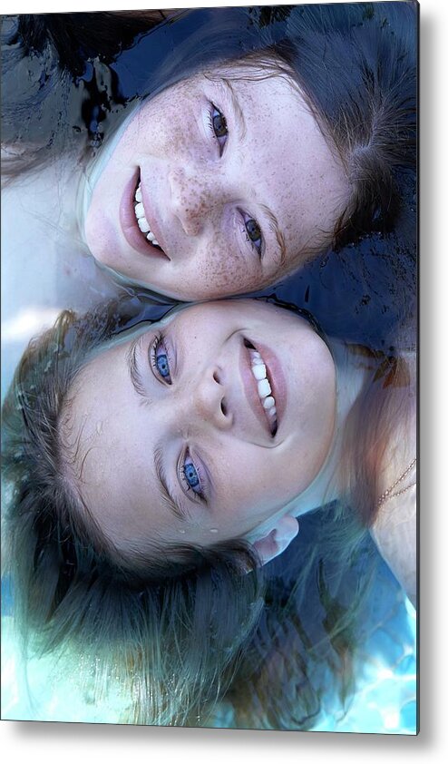 Two People Metal Print featuring the photograph Two Girls Floating In Water #1 by Ruth Jenkinson