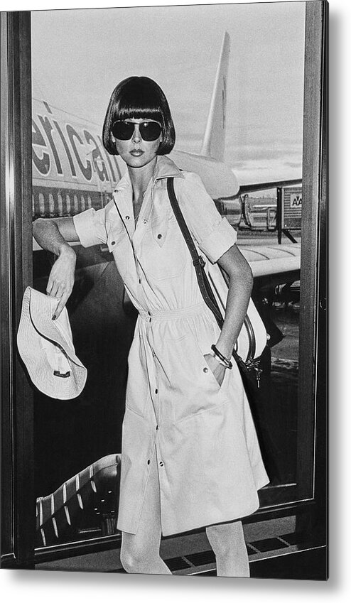 Accessories Metal Print featuring the photograph A Model Stands In The American Airlines Lounge by Chris von Wangenheim