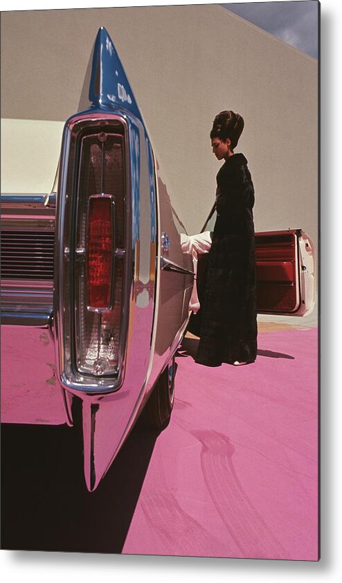 Auto Metal Print featuring the photograph A Model Wearing Emeric Partos Entering A 1965 by Gene Laurents