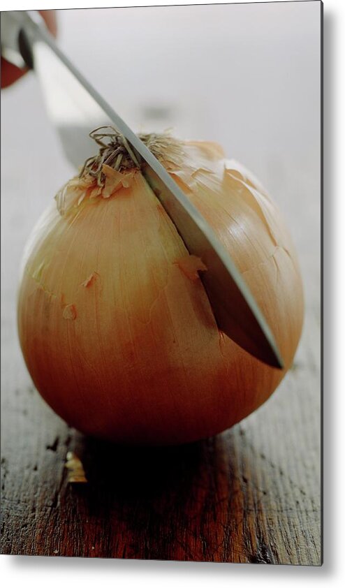 Fruits Metal Print featuring the photograph A Raw Onion Being Cut In Half by Romulo Yanes