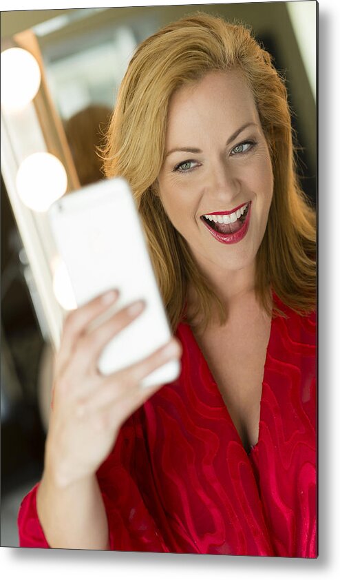 Mature Adult Metal Print featuring the photograph Caucasian woman taking cell phone selfie by Rick Gomez