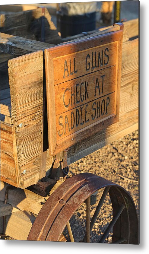 Guns Metal Print featuring the photograph Check Guns at Saddle Shop by Michael Hope