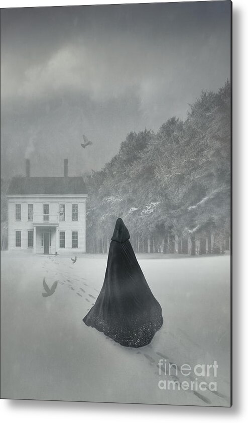 Atmosphere Metal Print featuring the photograph Cloacked figure walking in the snow with house in distance by Sandra Cunningham