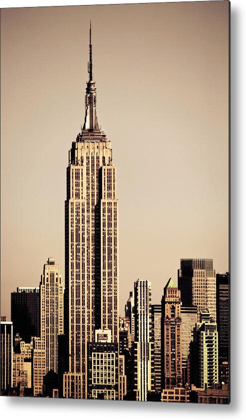 Clear Sky Metal Print featuring the photograph Empire State Building Amongst High-rise by Merten Snijders