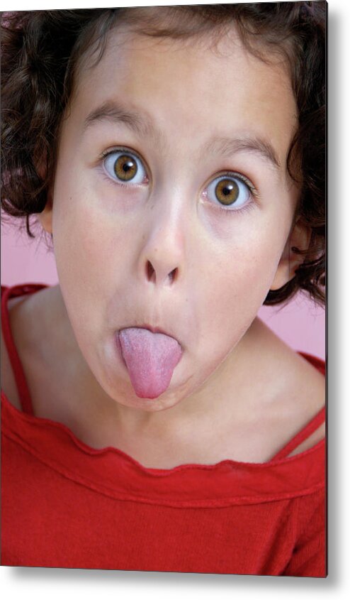 Face Metal Print featuring the photograph Girl Sticking Out Her Tongue by Aj Photo/science Photo Library