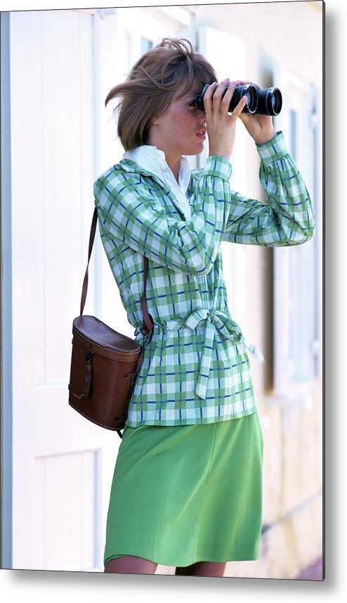 Fashion Metal Print featuring the photograph Model Wearing Plaid Jacket Holding Binoculars by William Connors