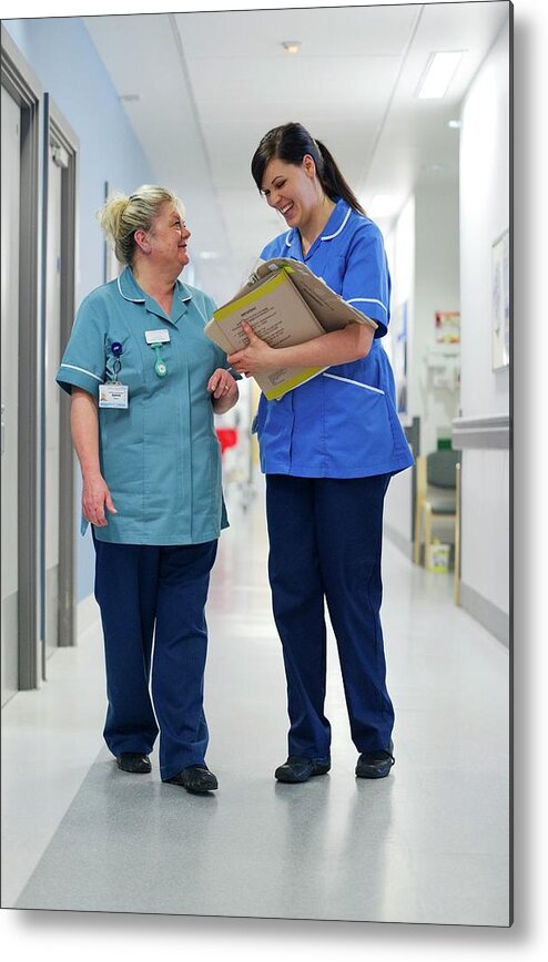 2 People Metal Print featuring the photograph Nurses Talking In Corridor by Lth Nhs Trust/science Photo Library
