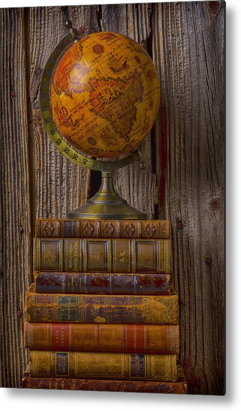 Globes Metal Print featuring the photograph Old globe on old books by Garry Gay