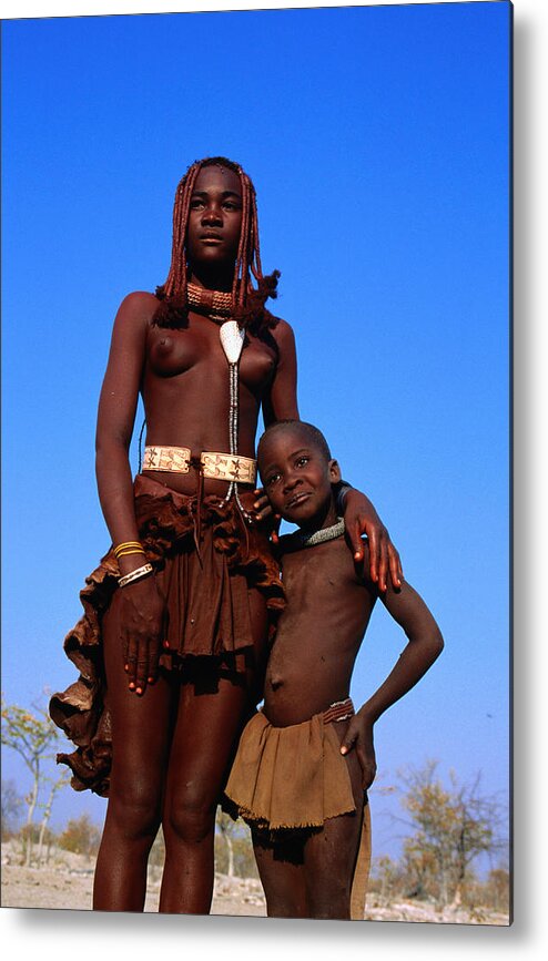 Mid Adult Women Metal Print featuring the photograph Portrait of woman and girl from Himba tribe. by Frans Lemmens