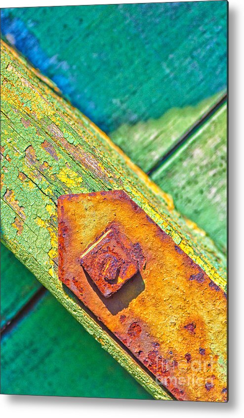 Abstract Metal Print featuring the photograph Rusty bolt on rotten green wood by Silvia Ganora