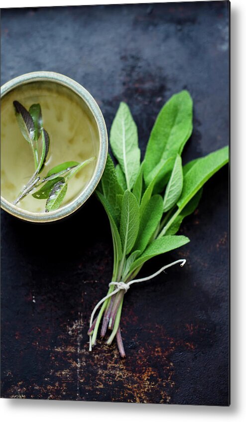 Spice Metal Print featuring the photograph Sage Tea In Small Cup With Bunch Of by Westend61