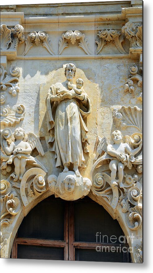 San Antonio Metal Print featuring the photograph Saint Joseph Holding Baby Jesus above the entrance to Mission San Jose in San Antonio Texas by Shawn O'Brien