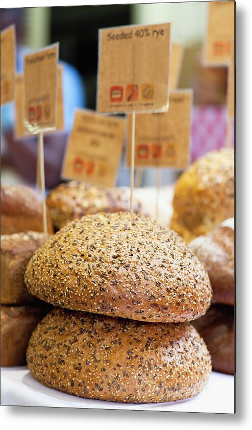 Bakery Metal Print featuring the photograph Stacks Of Fresh Bread For Sale by Hybrid Images