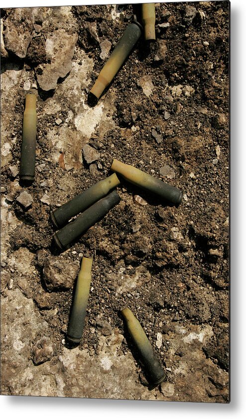 Bullet Metal Print featuring the photograph Used 8mm Rounds On The Ground by Robert Gallagher