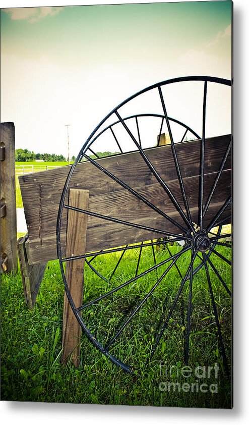 Wagon Metal Print featuring the photograph Wagon Wheel by Colleen Kammerer