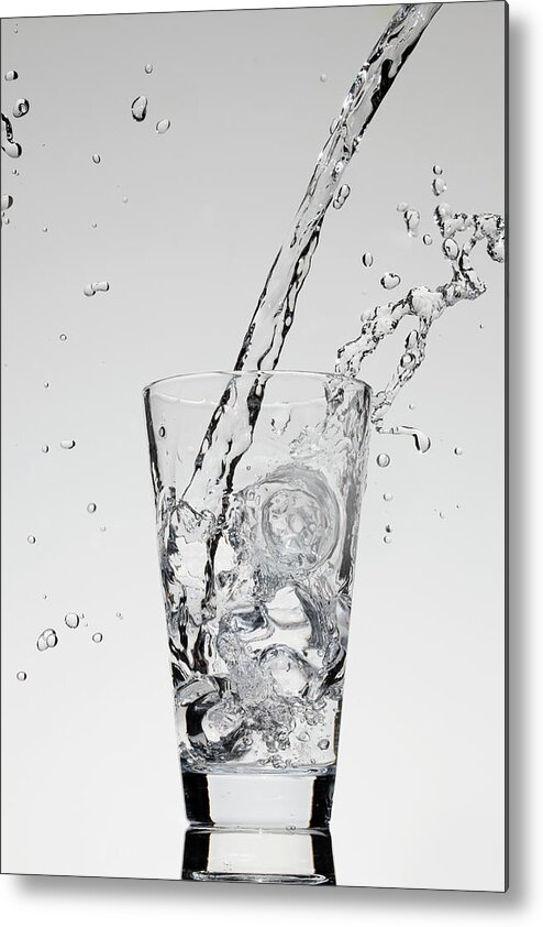 Mid-air Metal Print featuring the photograph Water Being Poured Into A Glass by Dual Dual