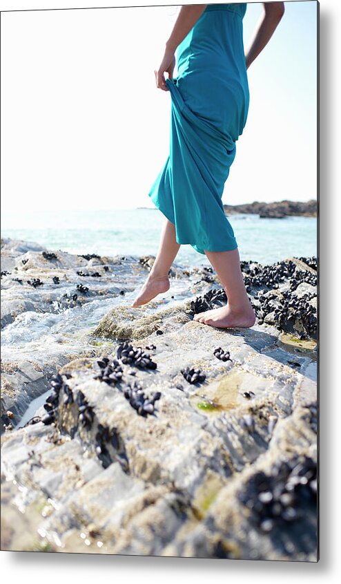 People Metal Print featuring the photograph Woman Walking Over Coastal Rocks by Dougal Waters
