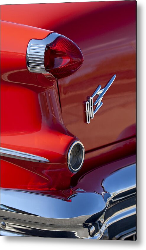 1956 Oldsmobile 88 Metal Print featuring the photograph 1956 Oldsmobile 88 Taillight Emblem by Jill Reger