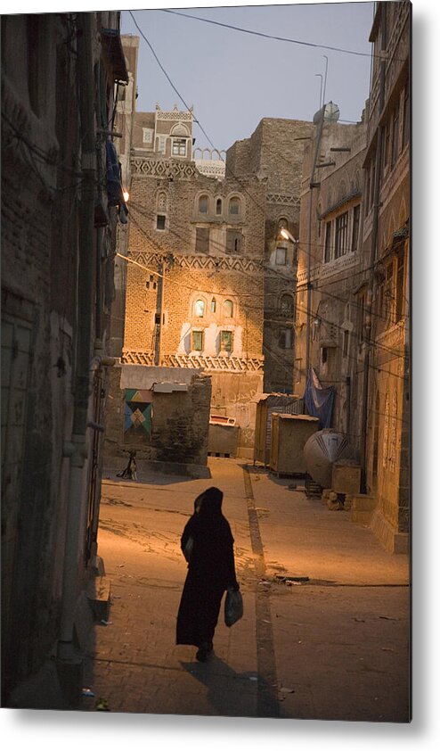 Human Age Metal Print featuring the photograph Woman Walking In Old Town, Dusk, San'a, Yemen, Middle East by Holger Leue