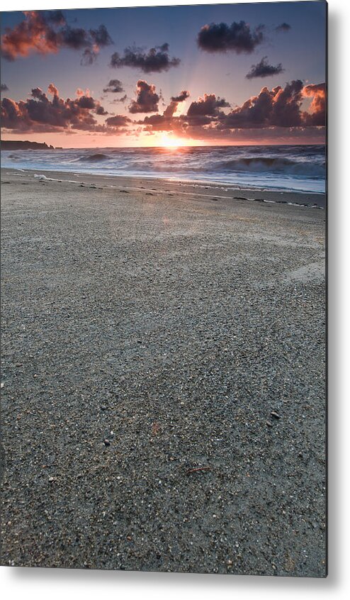 Beach Metal Print featuring the photograph A beach during sunset with glowing sky by U Schade