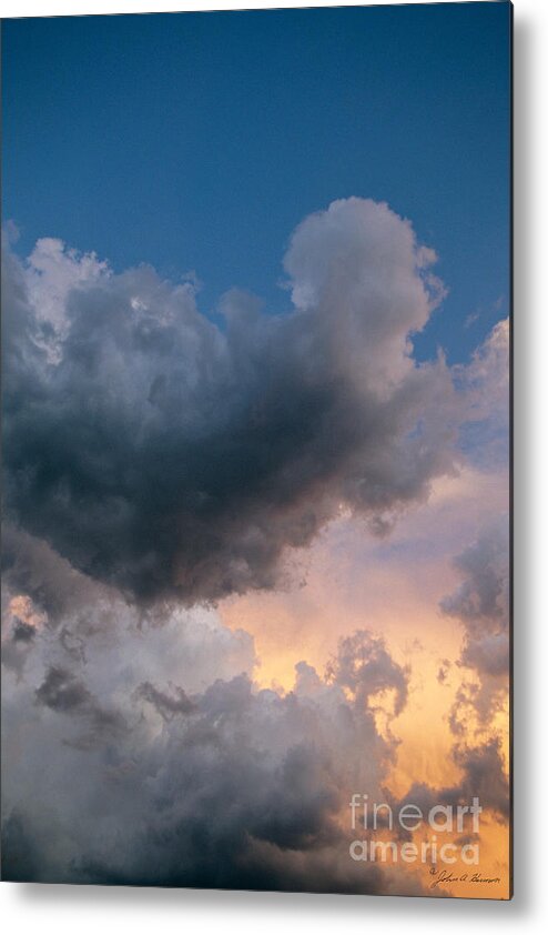 Sun Set Metal Print featuring the photograph An Angel Shaped Cloud by John Harmon