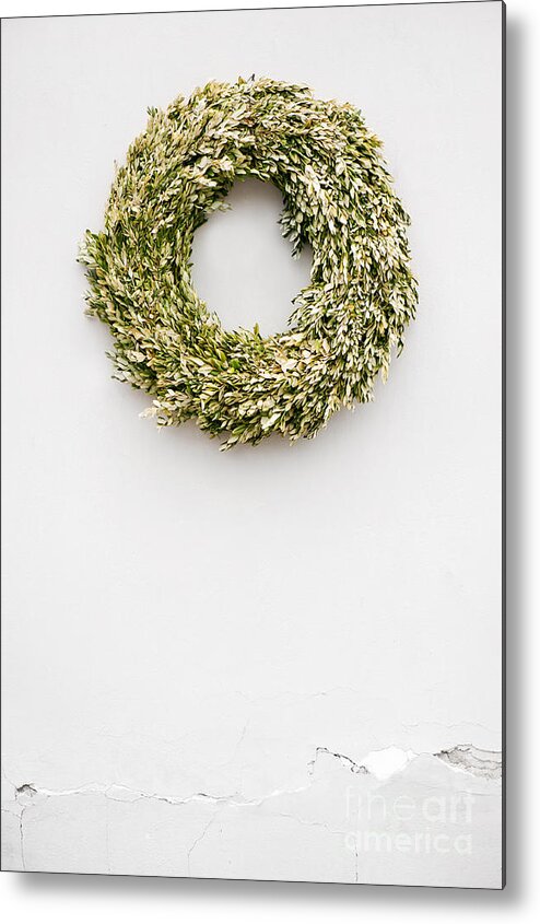 Wall Metal Print featuring the photograph Buxus wreath on white wall by Arletta Cwalina
