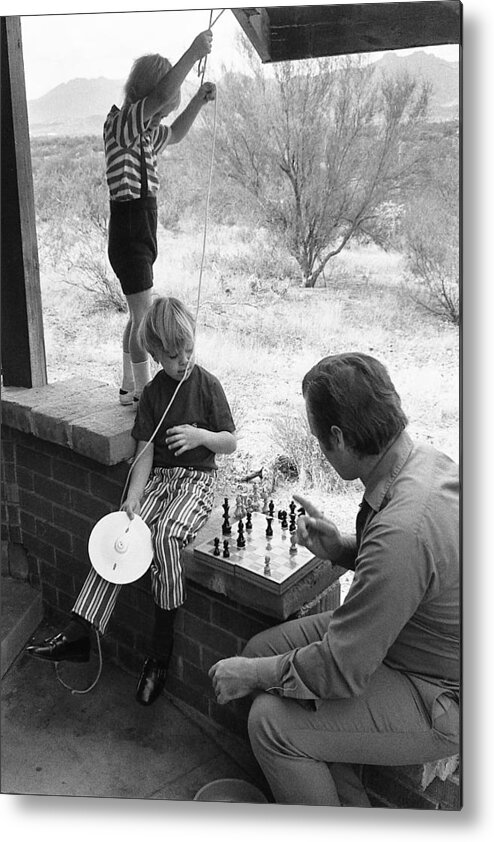 Closeup Of Barry Sadler Playing Chess With Thor Tucson Arizona 1971 Metal Print featuring the photograph Closeup of Barry Sadler playing chess with Thor Tucson Arizona 1971 by David Lee Guss