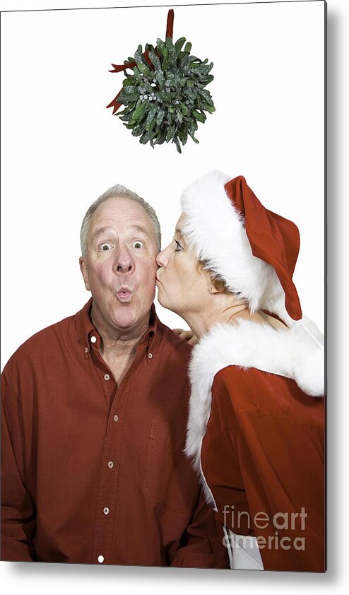 Man Metal Print featuring the photograph Kissed under the mistletoe by Karen Foley