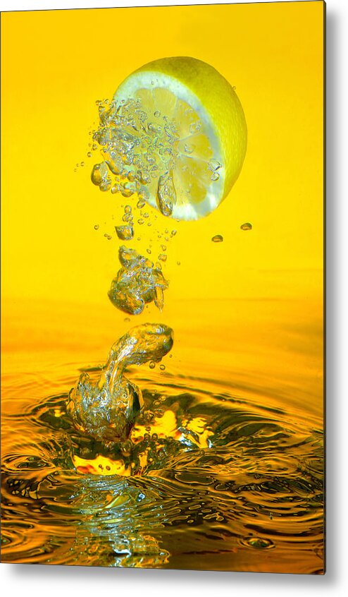 Pouring Metal Print featuring the photograph Lemon and bubbles by Travel Images Worldwide