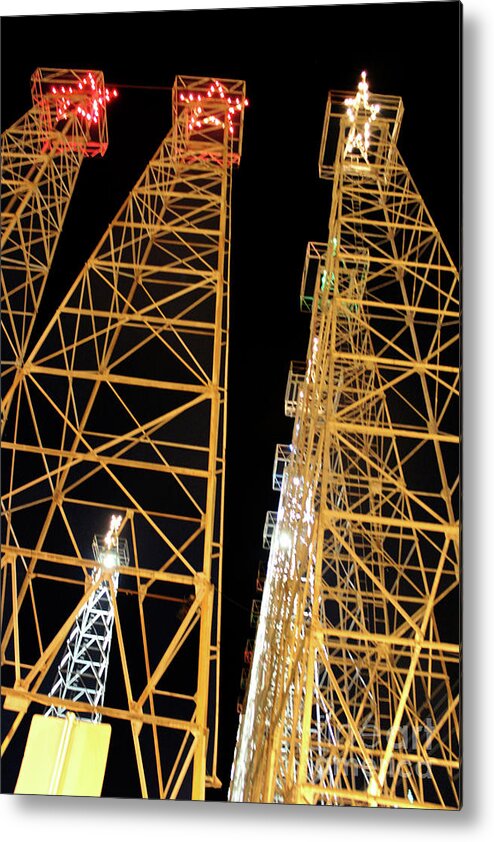 Kilgore Lighted Oil Derricks Metal Print featuring the photograph Looking Up At The Kilgore Lighted Derricks by Kathy White