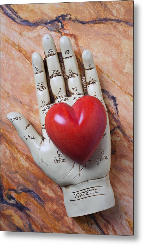 Palm Reader Hand Metal Print featuring the photograph Plam reader hand holding red stone heart by Garry Gay