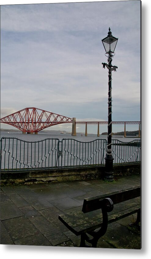 Forth Rail Bridge Metal Print featuring the photograph View at the Forth rail bridge from High Street in South Queensferry by Elena Perelman